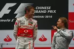 Foto zur News: Jenson Button (McLaren) und Nico Rosberg (Mercedes)