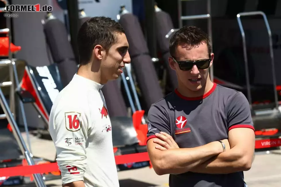 Foto zur News: Sébastien Buemi (Toro Rosso) und Christian Klien (HRT)