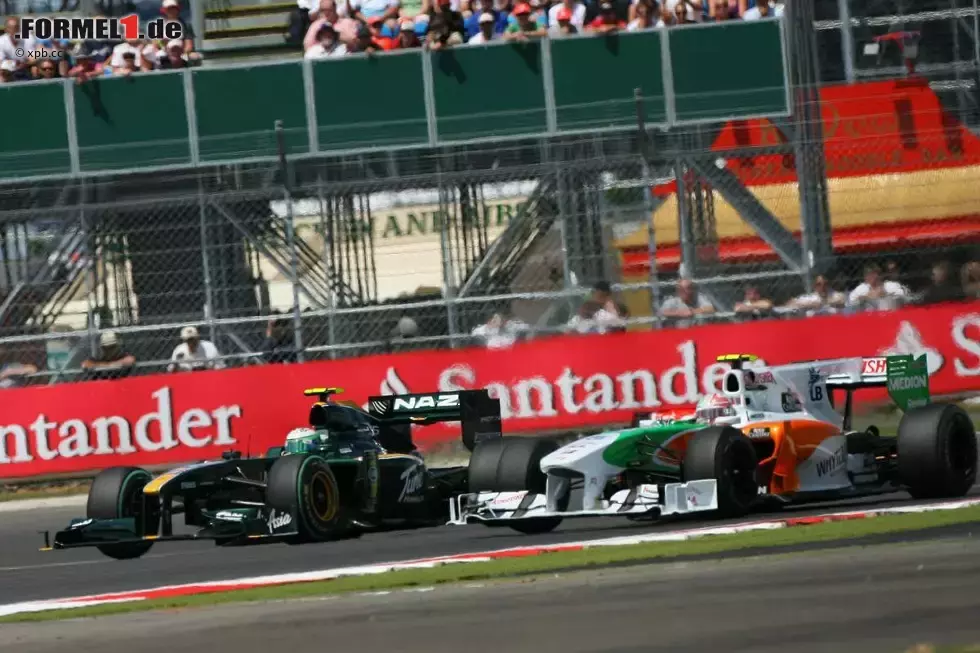 Foto zur News: Heikki Kovalainen (Lotus) und Vitantonio Liuzzi (Force India)