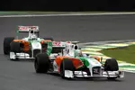 Foto zur News: Vitantonio Liuzzi vor Adrian Sutil (Force India)