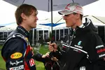 Foto zur News: Sebastian Vettel (Red Bull) und Michael Schumacher (Mercedes)