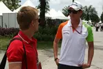 Foto zur News: Heikki Kovalainen (Lotus) und Adrian Sutil (Force India)