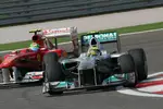 Foto zur News: Nico Rosberg (Mercedes) und Felipe Massa (Ferrari)