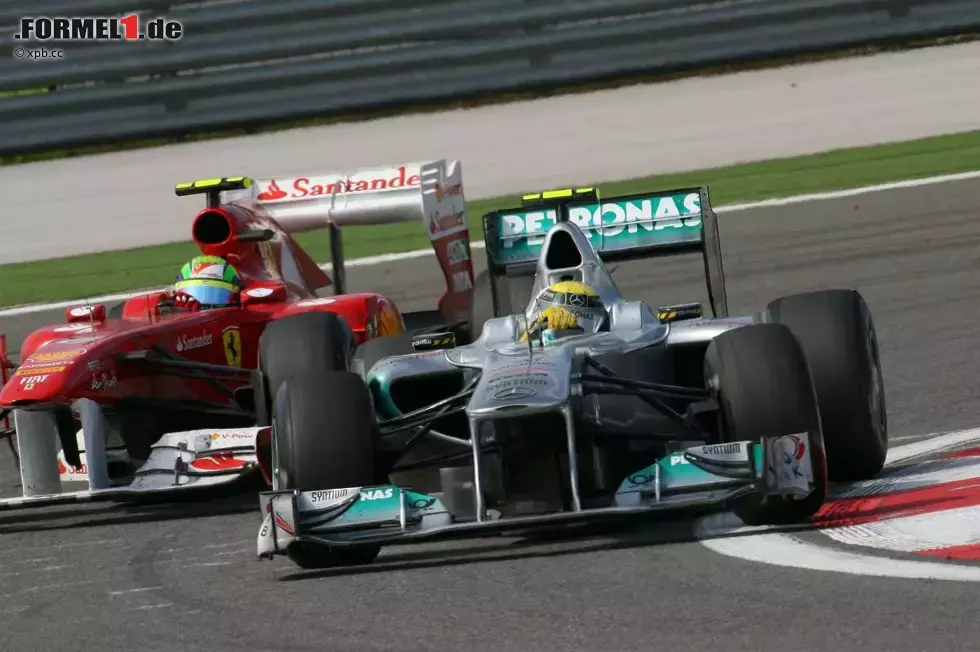 Foto zur News: Nico Rosberg (Mercedes) und Felipe Massa (Ferrari)