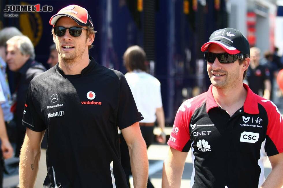 Foto zur News: Jenson Button (McLaren) und Timo Glock (Marussia-Virgin)
