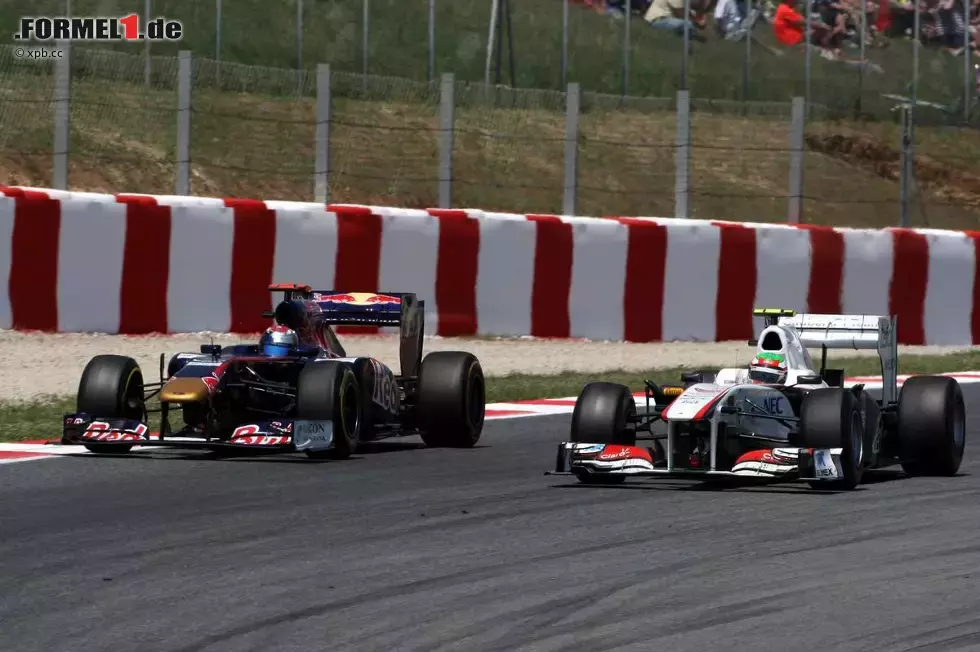 Foto zur News: Sebastien Buemi (Toro Rosso) und Sergio Perez (Sauber)