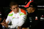 Foto zur News: Paul di Resta (Force India) und Lewis Hamilton (McLaren)