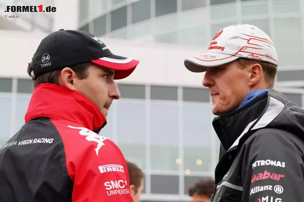 Foto zur News: Timo Glock (Marussia-Virgin) und Michael Schumacher (Mercedes)