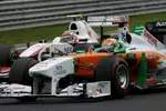 Foto zur News: Adrian Sutil (Force India) und Sergio Perez (Sauber)