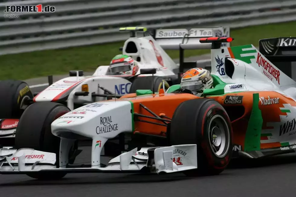 Foto zur News: Adrian Sutil (Force India) und Sergio Perez (Sauber)