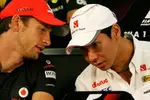 Foto zur News: Jenson Button (McLaren) und Kamui Kobayashi (Sauber)