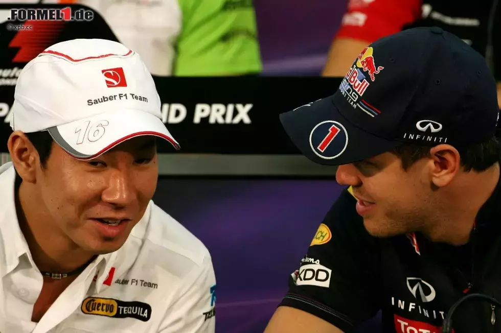 Foto zur News: Kamui Kobayashi (Sauber) und Sebastian Vettel (Red Bull)