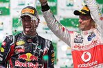 Foto zur News: Mark Webber (Red Bull) und Jenson Button (McLaren)