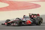 Foto zur News: Jenson Button (McLaren) und Kimi Räikkönen (Lotus)