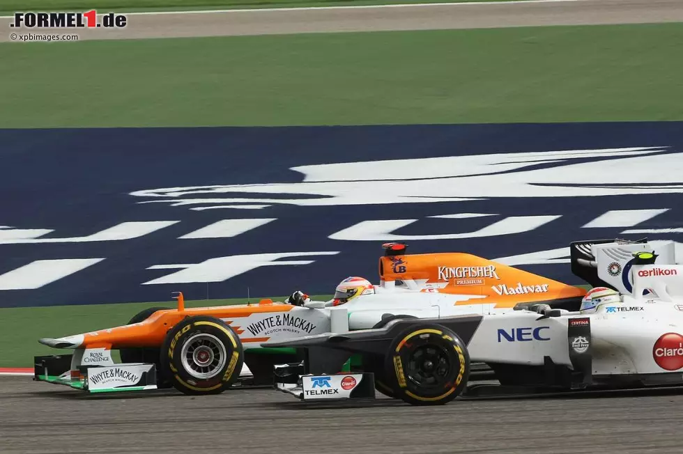 Foto zur News: Paul di Resta (Force India) und Sergio Perez (Sauber)