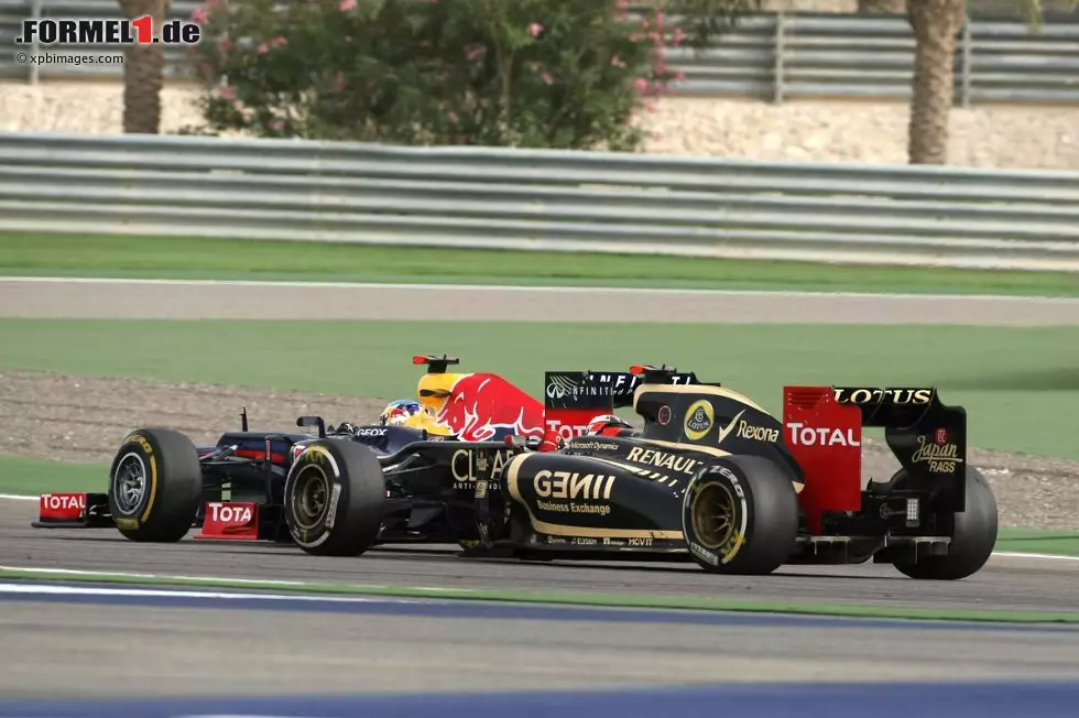 Foto zur News: Kimi Räikkönen (Lotus) und Sebastian Vettel (Red Bull)