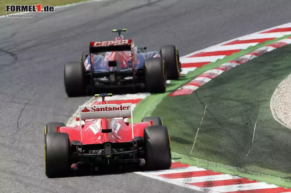 Foto zur News: Jean-Eric Vergne (Toro Rosso) und Felipe Massa (Ferrari) - der Brasiliener hatte im Rennen wieder einmal keine Chance.