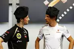 Foto zur News: Romain Grosjean (Lotus) und Jenson Button (McLaren)