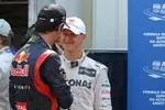 Foto zur News: Mark Webber (Red Bull) und Michael Schumacher (Mercedes)