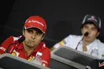 Foto zur News: Felipe Massa (Ferrari) und Sergio Perez (Sauber)