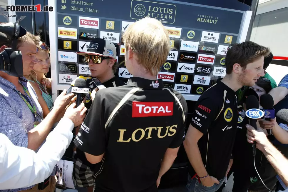 Foto zur News: Kimi Räikkönen (Lotus) und Romain Grosjean (Lotus)