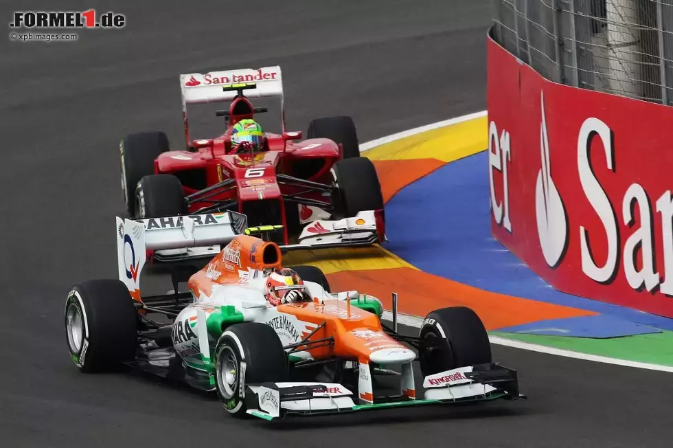 Foto zur News: Jules Bianchi (Force India) und Felipe Massa (Ferrari) im ersten Training am Freitag in Valencia.