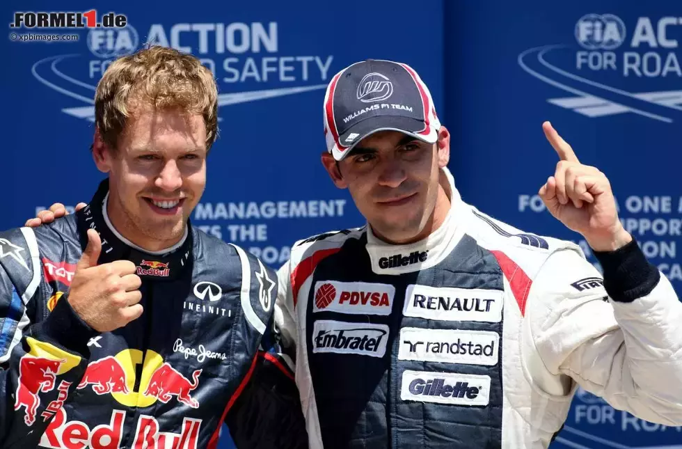 Foto zur News: Sebastian Vettel (Red Bull) und Pastor Maldonado (Williams)