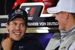 Foto zur News: Sebastian Vettel (Red Bull) und Michael Schumacher (Mercedes)