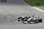 Foto zur News: Paul di Resta (Force India) und Kamui Kobayashi (Sauber)