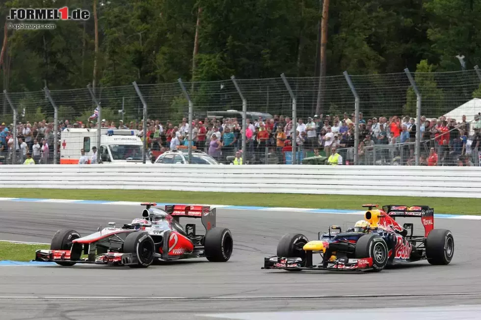 Foto zur News: Sebastian Vettel (Red Bull) und Jenson Button (McLaren)