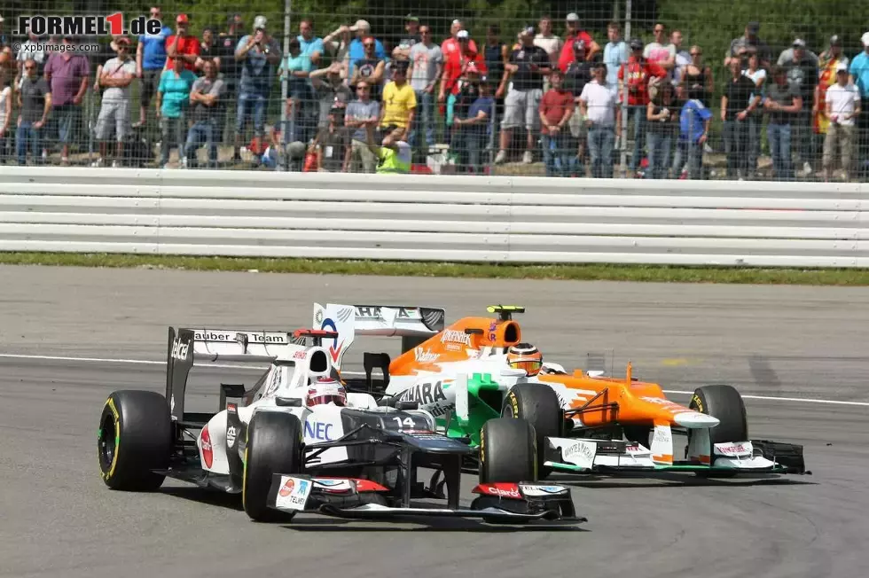 Foto zur News: Kamui Kobayashi (Sauber) und Nico Hülkenberg (Force India)