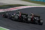 Foto zur News: Kimi Räikkönen (Lotus) und Romain Grosjean (Lotus)