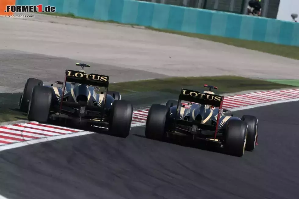 Foto zur News: Kimi Räikkönen (Lotus) und Romain Grosjean (Lotus)