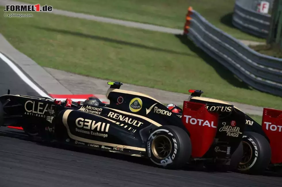 Foto zur News: Kimi Räikkönen (Lotus) und Romain Grosjean (Lotus)