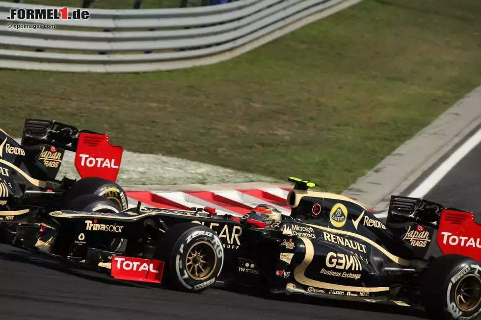 Foto zur News: Kimi Räikkönen (Lotus) und Romain Grosjean (Lotus)