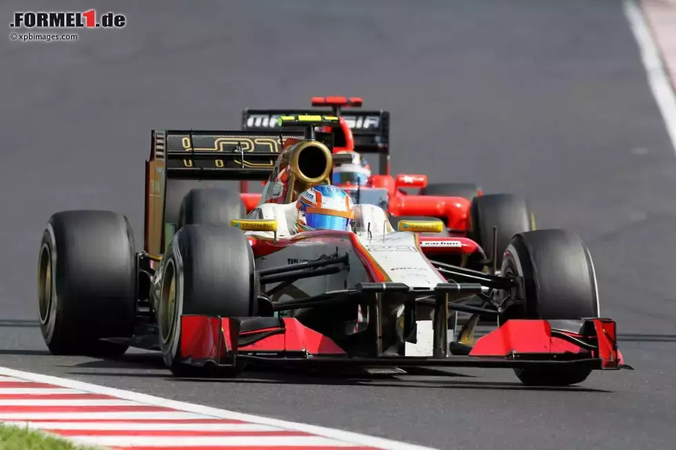 Foto zur News: Narain Karthikeyan (HRT) und Timo Glock (Marussia)