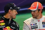 Foto zur News: Sebastian Vettel (Red Bull) und Jenson Button (McLaren)