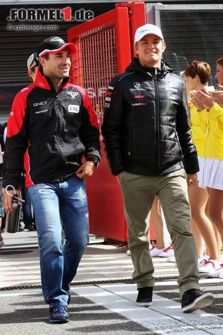 Foto zur News: Timo Glock (Marussia) und Nico Rosberg (Mercedes)