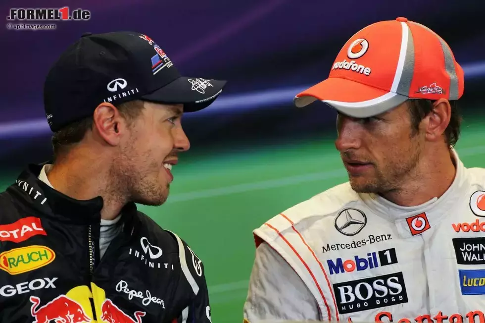 Foto zur News: Sebastian Vettel (Red Bull) und Jenson Button (McLaren)