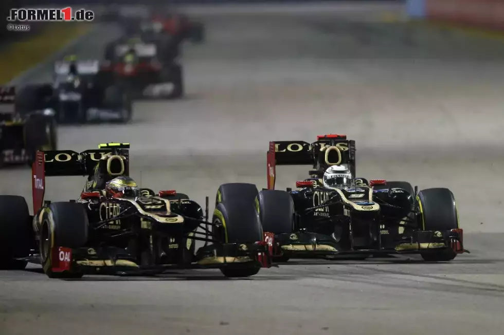 Foto zur News: Romain Grosjean (Lotus) und Kimi Räikkönen (Lotus)