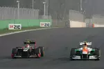 Foto zur News: Romain Grosjean (Lotus) und Nico Hülkenberg (Force India)