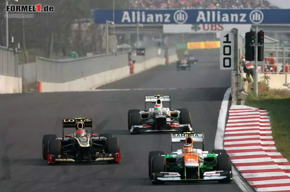 Foto zur News: Romain Grosjean (Lotus) und Nico Hülkenberg (Force India)