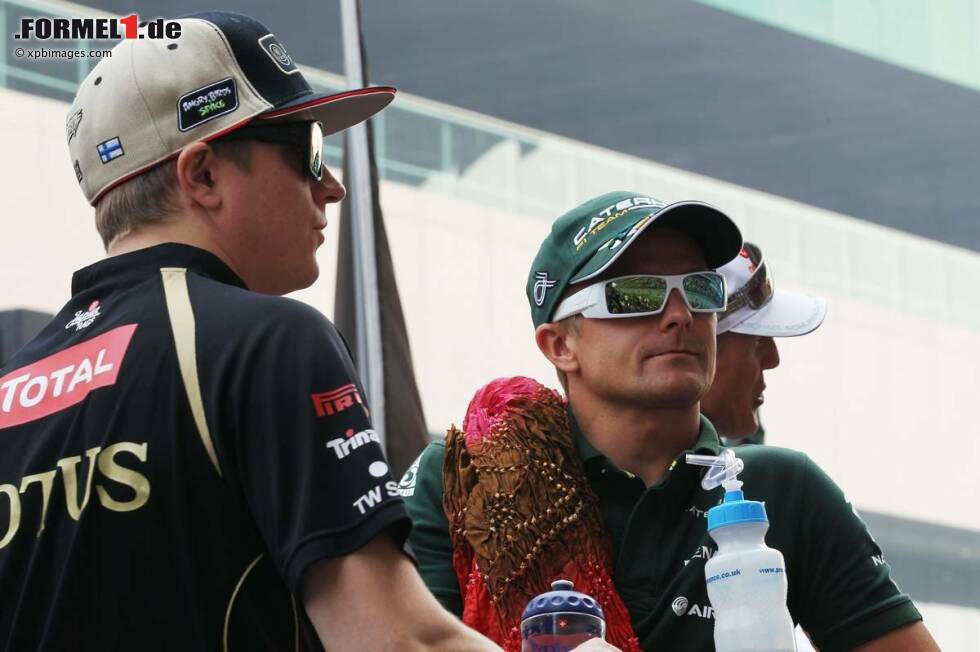 Foto zur News: Heikki Kovalainen (Caterham) und Kimi Räikkönen (Lotus)