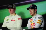 Foto zur News: Sebastian Vettel (Red Bull) und Kimi Räikkönen (Lotus)