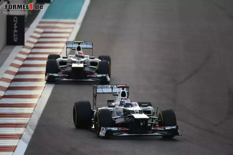 Foto zur News: Kamui Kobayashi (Sauber) und Sergio Perez (Sauber)