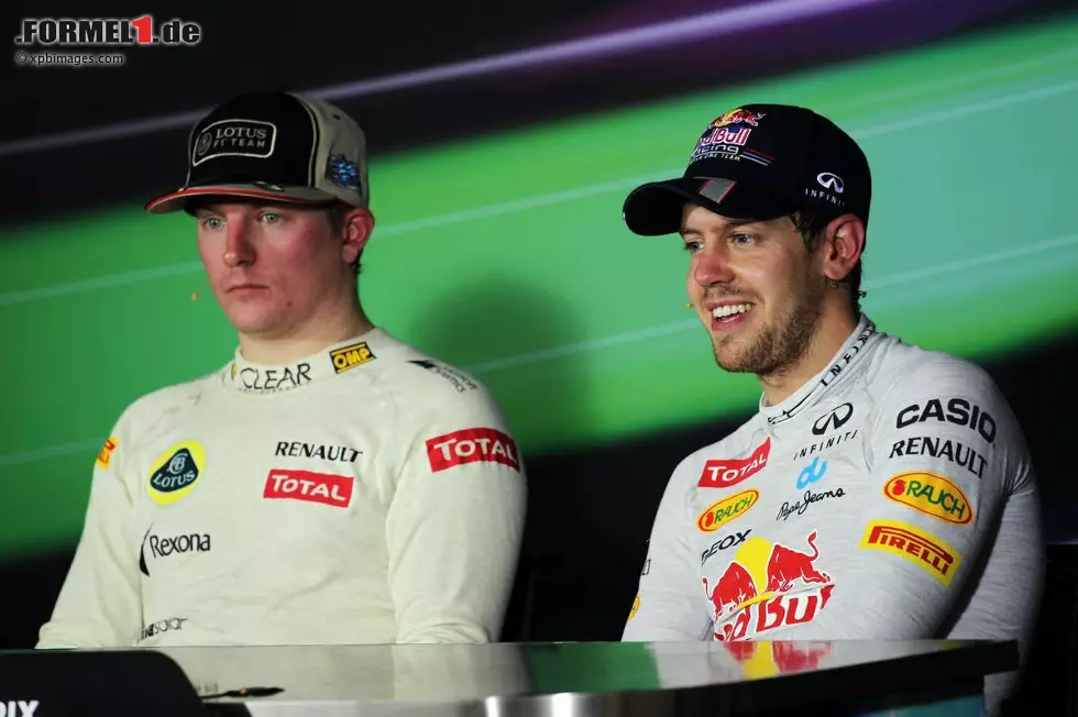 Foto zur News: Sebastian Vettel (Red Bull) und Kimi Räikkönen (Lotus)