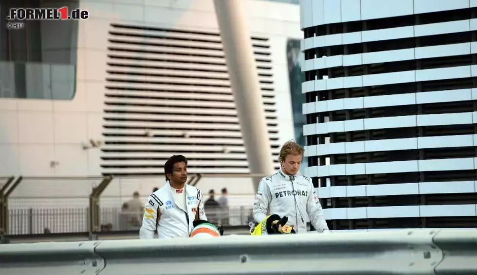 Foto zur News: Narain Karthikeyan (HRT) und Nico Rosberg (Mercedes)