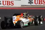 Foto zur News: Romain Grosjean (Lotus) und Nico Hülkenberg (Force India)