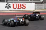 Foto zur News: Romain Grosjean (Lotus) und Nico Hülkenberg (Force India)