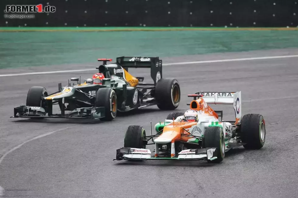 Foto zur News: Paul di Resta (Force India) und Heikki Kovalainen (Caterham)